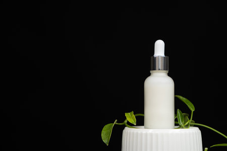 Natural herbal eco cosmetics - cream or serum in a glass jar with a pipette dispenser.の写真素材