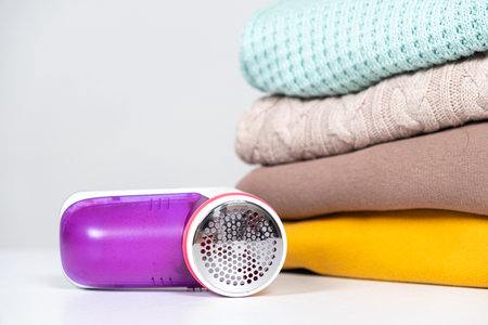 Anti-pilling razor for removing pills from clothes, a place for text. Clothing care deviceの写真素材