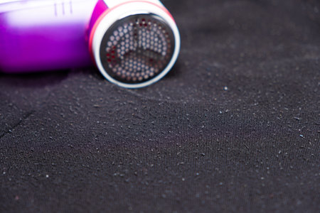 Anti-pilling razor for removing pills from clothes, a place for text. Clothing care deviceの写真素材
