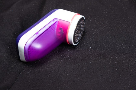 Anti-pilling razor for removing pills from clothes, a place for text. Clothing care deviceの写真素材