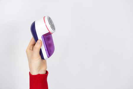 Anti-pilling razor for removing pills from clothes, a place for text. Clothing care deviceの写真素材