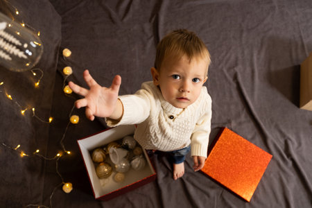 Portrait of happy little child playing with Christmas toys.の写真素材