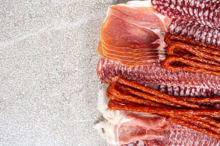Various cold meat appetizers - Spanish ham cerrato, salami, sausages.