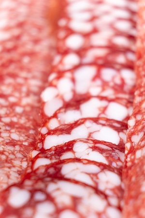 Thin slices of smoked sausage close-upの写真素材