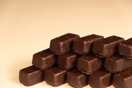 Chocolates on beige background copy space for text
