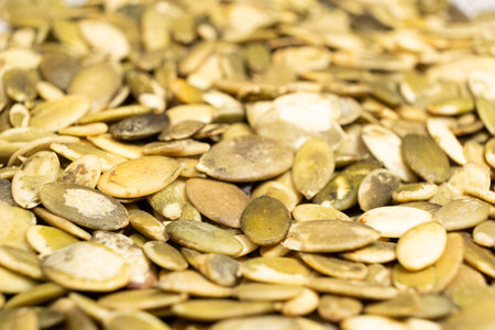 Peeled pumpkin seeds, kernels close-up.の写真素材