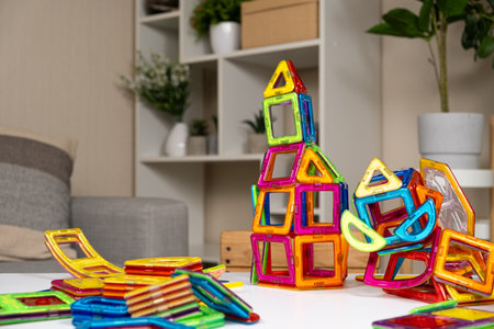 Magnetic constructor buildings on the table. Educational toysの写真素材
