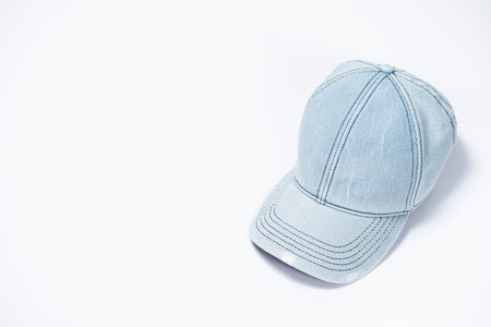 Blue denim cap close-up on white background, copy space for text.の写真素材
