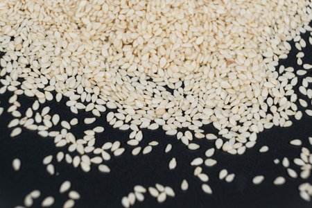 Macro kernels of white roasted sesame seeds.の写真素材