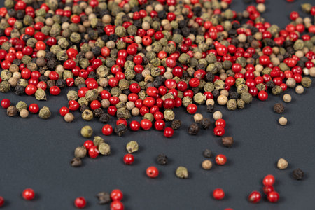 A mixture of different peppercorns white, black, red and green peppers spicesの写真素材