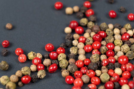 A mixture of different peppercorns white, black, red and green peppers spicesの写真素材