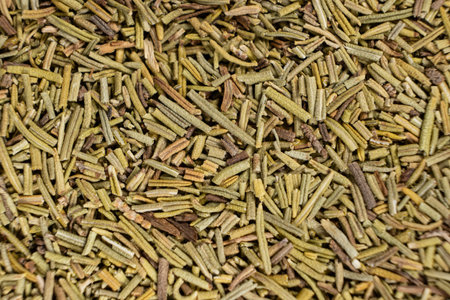 Background macro dried rosemary leaves top view, seasoning texture