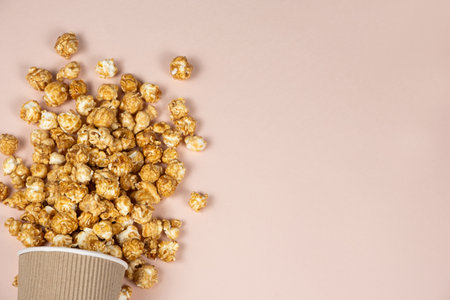 Sweet caramelized popcorn spilled out. Copy space for textの写真素材