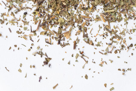 Dry basil spice seasoning macro texture on white backgroundの写真素材