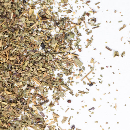 Dry basil spice seasoning macro texture on white backgroundの写真素材