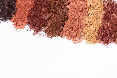 Scattered eye shadows in different shades. Cosmetics texture, white backgroundの写真素材