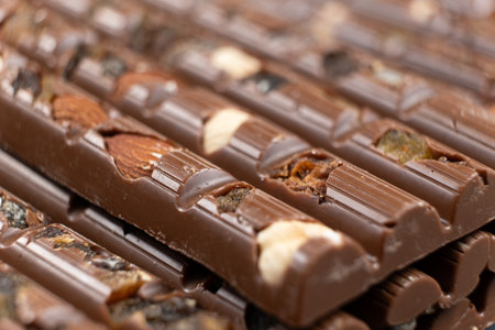 Macro background of milk nut chocolate with raisinsの写真素材