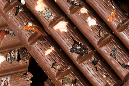 Close-up of milk nut chocolate. Healthy sweets, lactose-free and sugar-free chocolate.
