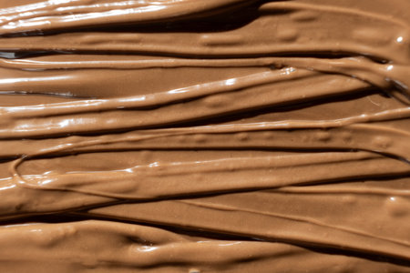 Macro Texture Natural Melted Milk Chocolate Top View.の写真素材