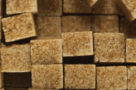 Cubes of brown cane unrefined demerara sugarの写真素材