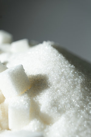 White refined beet sugar in the form of crystals and cubesの写真素材