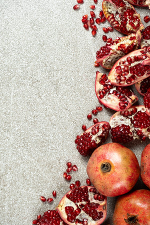 Ripe pomegranates, peeled and whole, place for textの写真素材