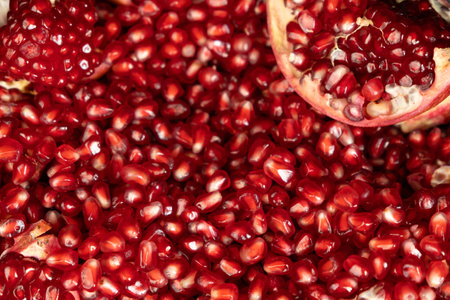 Pomegranate background, lots of peeled pomegranates and seedsの写真素材