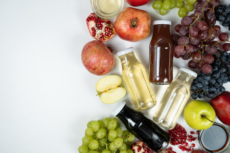 Different types of vinegar balsamic, apple, wine and pomegranate in glass bottles. Copy space for text.の写真素材