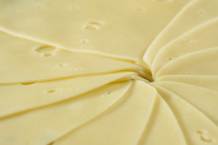 Semi-hard cheese close-up, thin slicesの写真素材