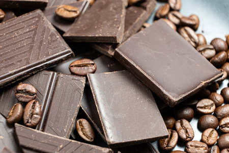 Dark chocolate pieces with coffee beans close-up