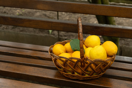 Basket full of fresh ripe lemons close-upの写真素材