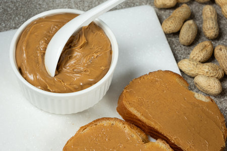 Peanut butter for breakfast, fresh bread with peanut butter.