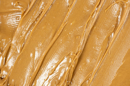 Creamy Texture American Natural Peanut Butter Top View Macro.の写真素材