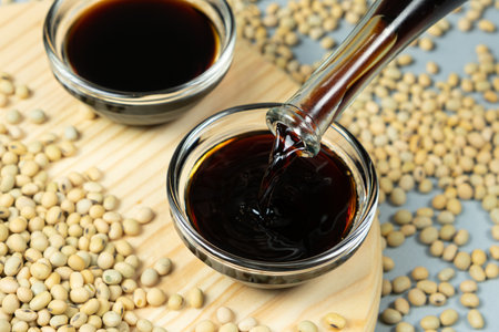 Stream of Soy Sauce Filling a Sauce Dish.の写真素材