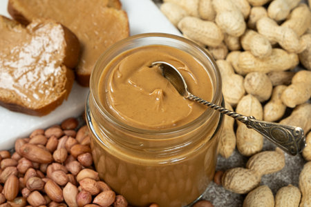 Peanut butter for breakfast, fresh bread with peanut butter.の写真素材