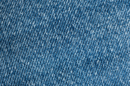 Blue Denim Textile Background. Cotton Jeans Macro Top View.の写真素材