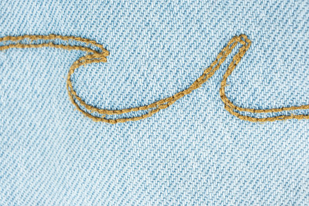 Detailed View of Blue Jeans Fabric and Thread Stitching.の写真素材