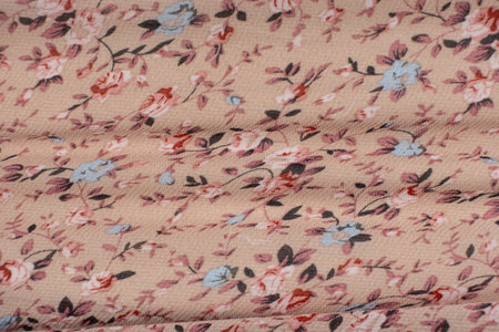 Synthetic Polyester Fabric with Bright Flower Print Close-Up.の写真素材
