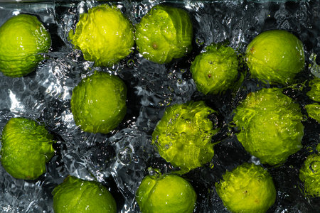 Whole Limes in Water with Soft Ripples.の写真素材