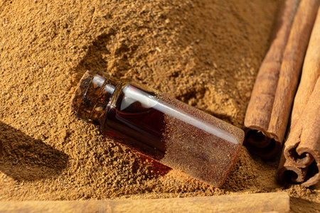 Natural cinnamon essential oil in a glass bottle close-upの写真素材