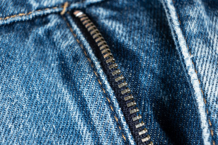 Macro Close-Up of Denim Zipper on Blue Jeans.の写真素材