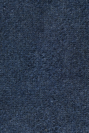 Old worn-out cotton and elastane fabric, fabric fibers and pilling.の写真素材