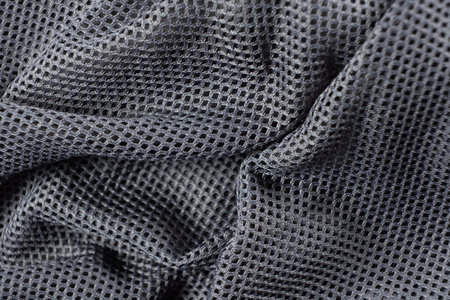 Synthetic polyester fabric macro top view, gray fabric background.の写真素材