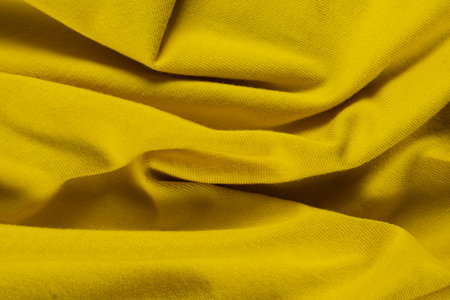 Rich Yellow Fabric Macro Texture Background.の写真素材