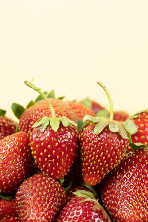 Macro fresh whole strawberry, vertical background, space for textの写真素材