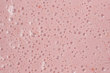 Strawberry milkshake surface, abstract cooking pink background with bubblesの写真素材
