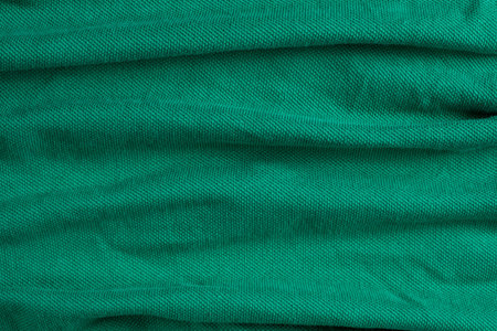 Close-Up of Abstract Green Emerald Cotton Textile Surface Top View.