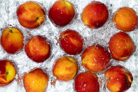 Juicy Fresh Peaches Floating in Clear Water. Aesthetic Top Viewの写真素材