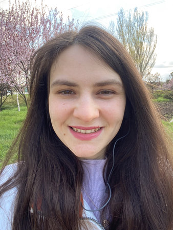 Spring selfie of a happy 30 year old brunette womanの写真素材