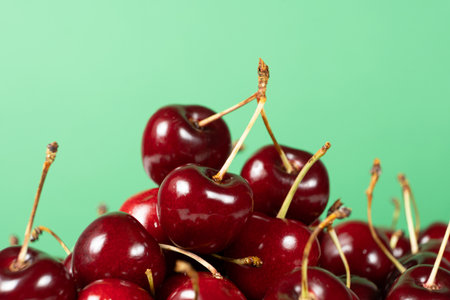 Fresh Sweet Cherries with Vibrant Green Backdrop